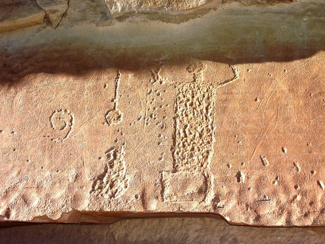 9DB6BFC2-155D-451F-67F6FE673738C415Original Petroglyph at Chaco Culture NHP showing abrasion, drilling, and carving.
