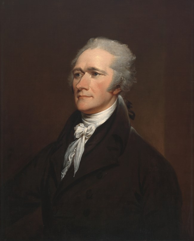 A painted portrait of Alexander Hamilton, who wears a black coat and white neck ruffles, and has gray hair.