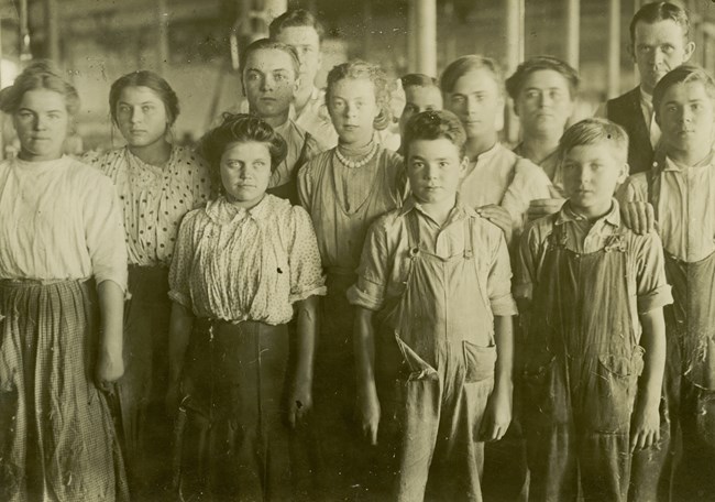 Picture of a group of child laborers in a mill