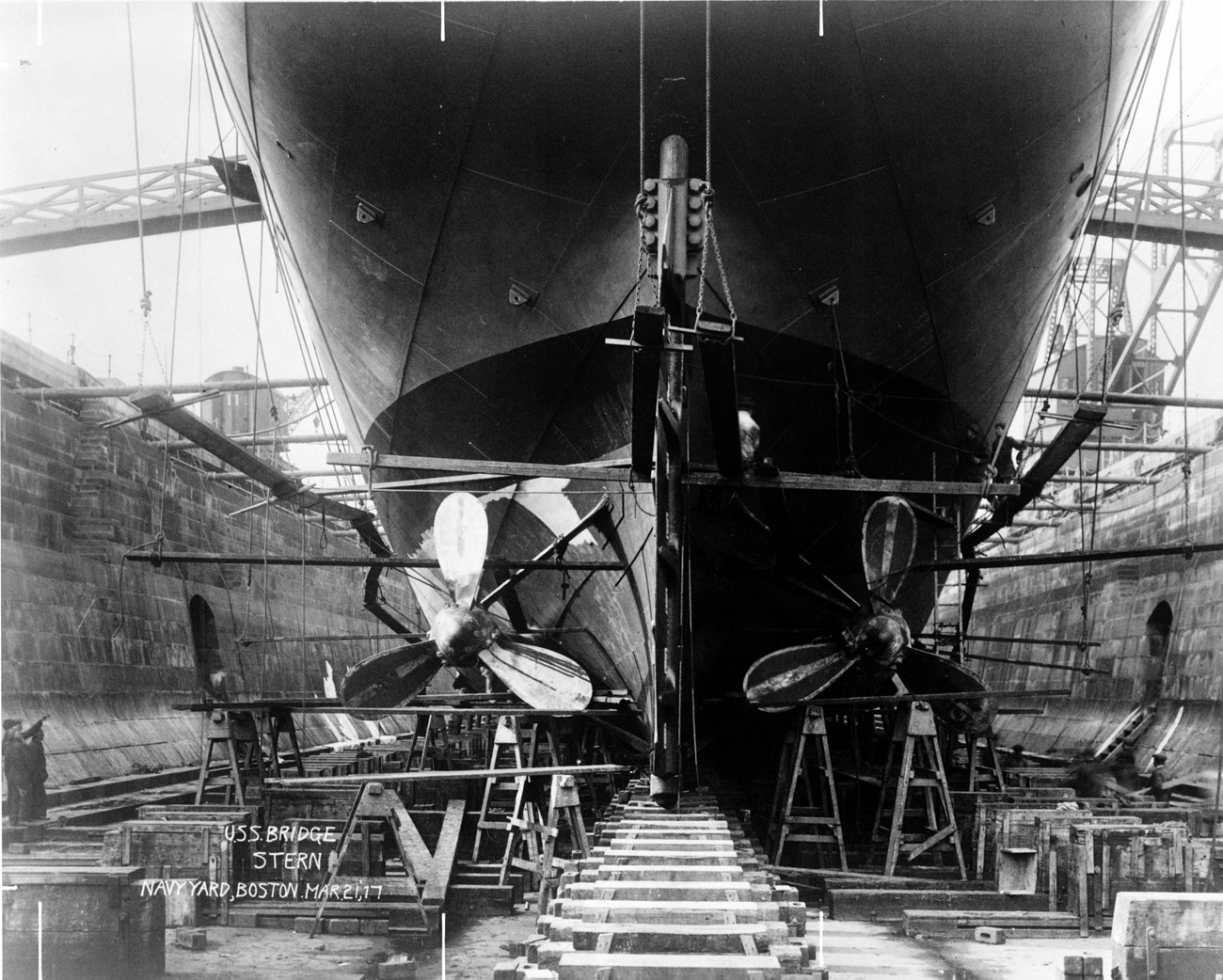 The hull of a ship from within a dry dock.