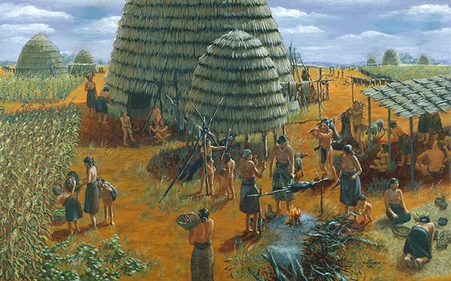 An illustration of American Indians in a thatched hut village.