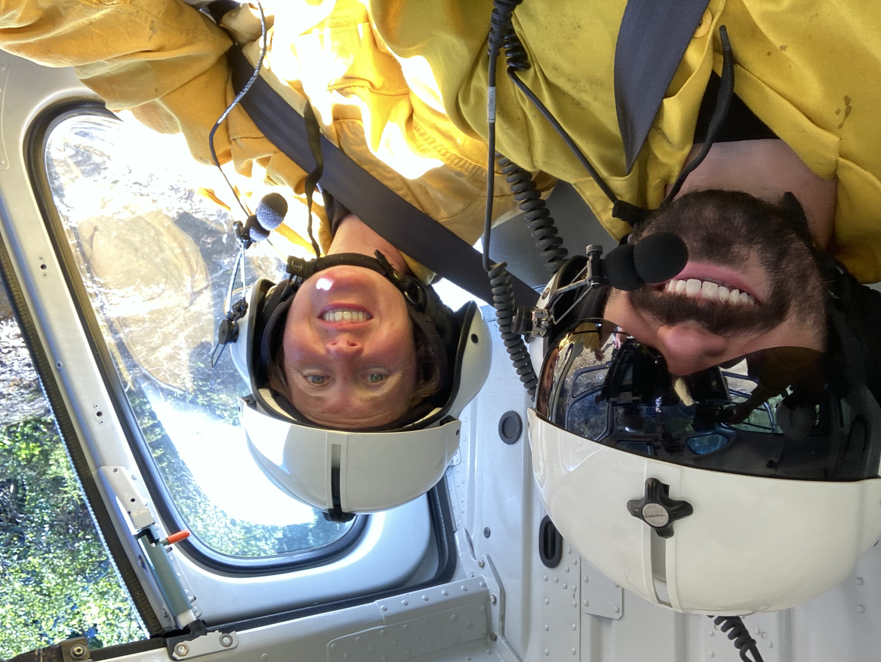 Closeup of two crew members from the BLM/Forest Service/Park Service crew on an AFS/BLM helicopter (Ryan Nessle, NPS)
