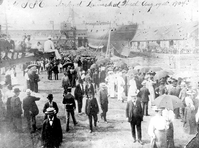 Cumberland-10842-1 Crowd of people gathrering around a ship for its launching.