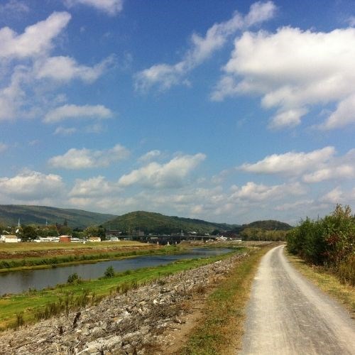 lt= Scenic view of the towpath, mountains, and blue sky in Cumberland, Maryland.