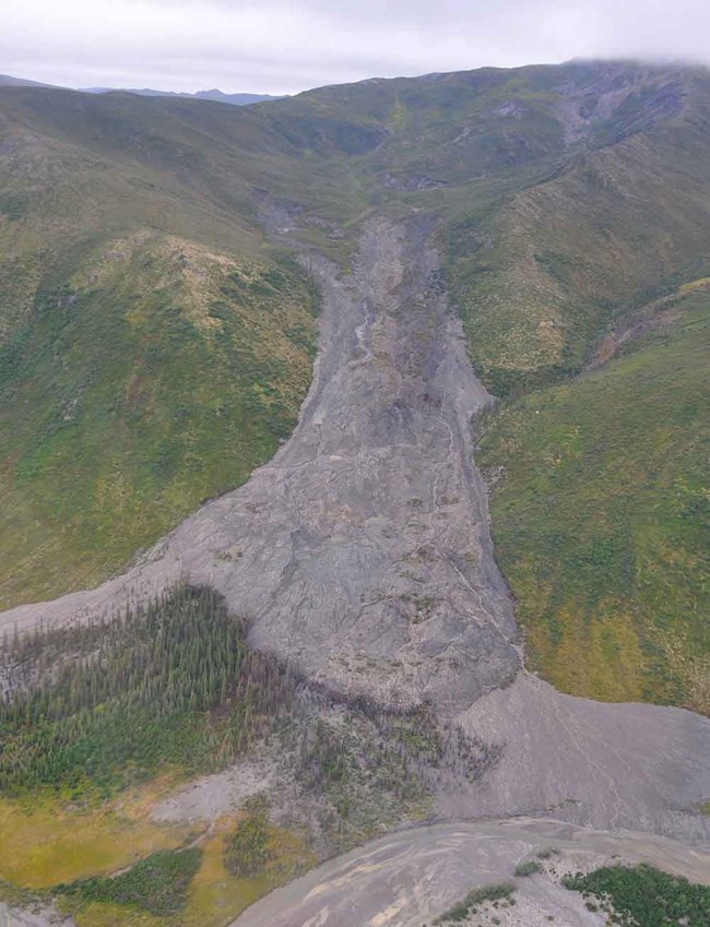Thawing river of human waste is sliding down Alaska mountain - The