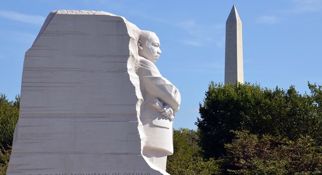 Martin Luther King, Jr. Memorial (NPS / Bill Shugarts) Statue of Dr. Martin Luther King Jr. with the Washington Monument in the distance