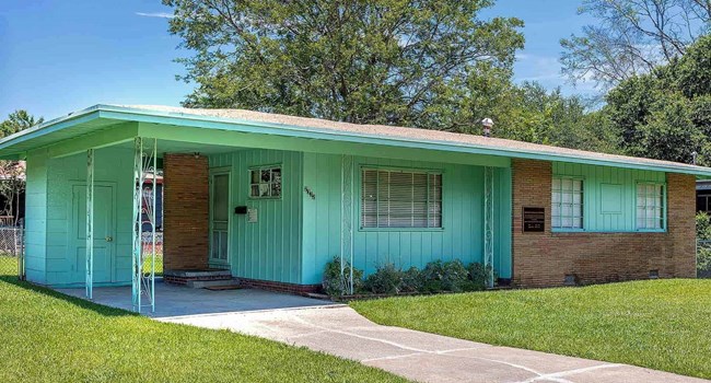 Medgar and Myrlie Evers Home National Monument One-story green home with a prominent carport