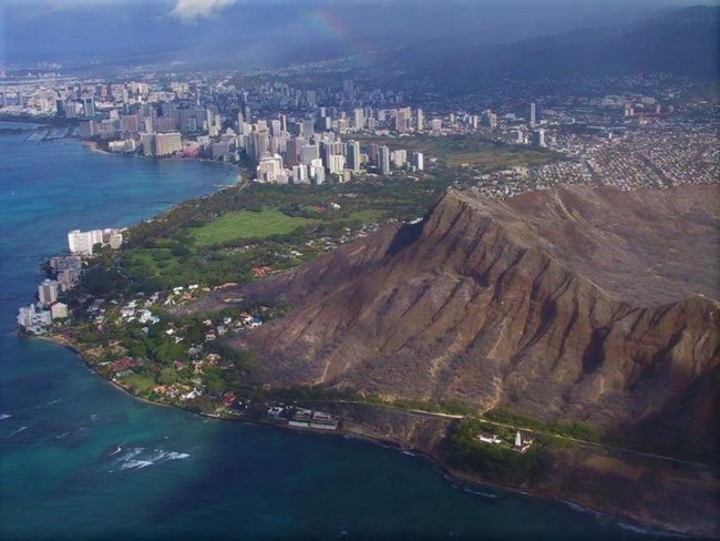 Diamon Head_HI_Thomas Fake Mountain peak surrounded by a city