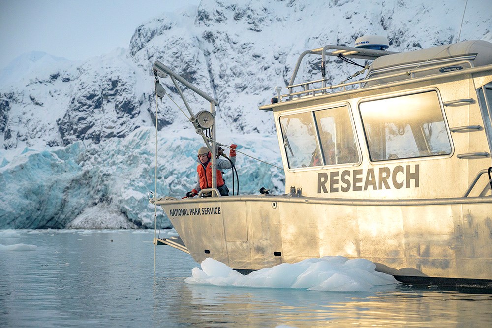 A research vessel on a snowy fjord.