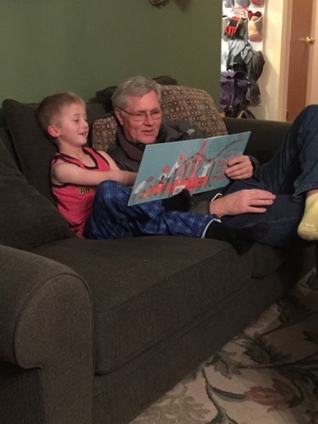 Figure 7 an adult reading a book to a child