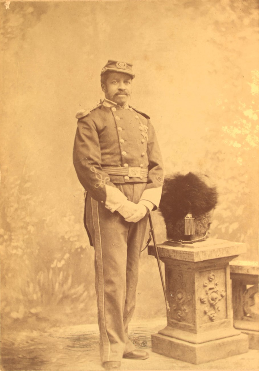 Black veteran Christian A. Fleetwood in the uniform of a Captain of the Washington Cadet Corps. On his chest, the Butler Colored Troops Medal and the Medal of Honor. He was a Captain of the WCC from 1880-1887, and in the DCNG from 1887-1892. Black veteran Christian A. Fleetwood in the uniform of a Captain of the Washington Cadet Corps. On his chest, the Butler Colored Troops Medal and the Medal of Honor. He was a Captain of the WCC from 1880-1887, and in the DCNG from 1887-1892.