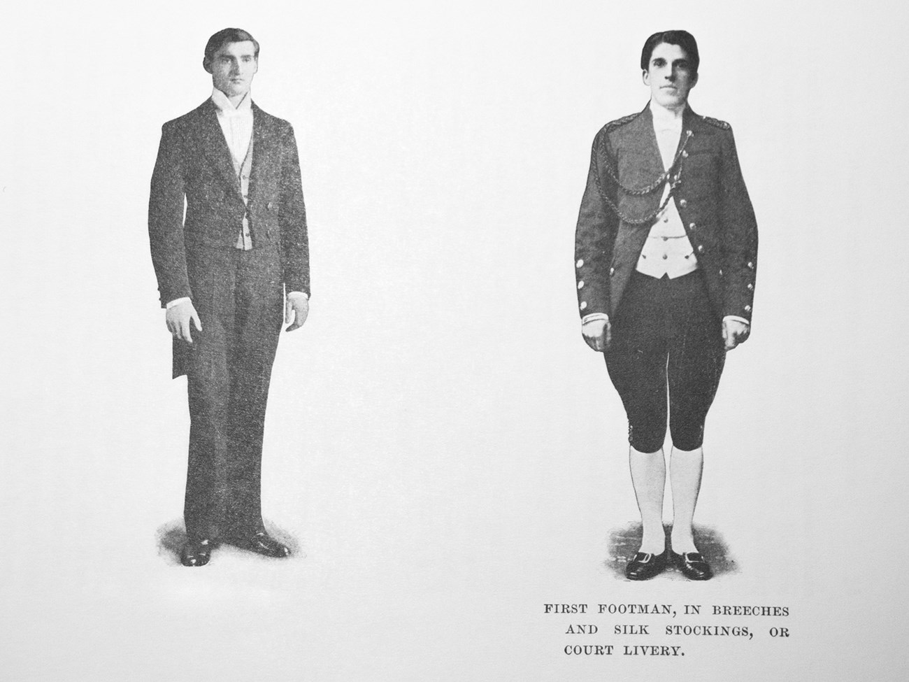 A photograph of two men in formal suits.