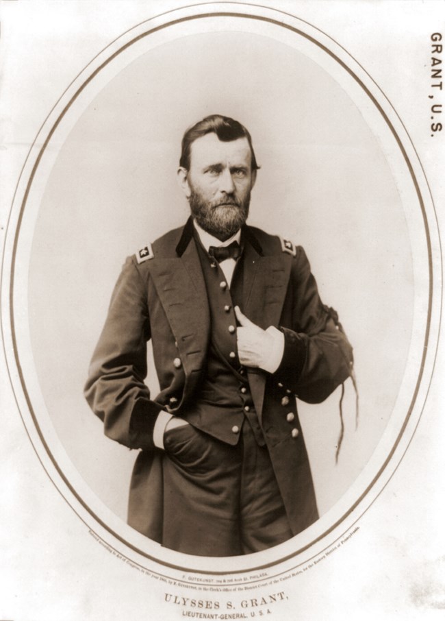 Black and white photo of a man in uniform, photographed from the waist up