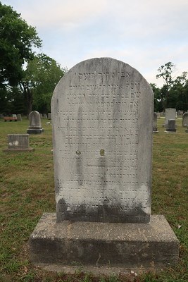 Gravestone with two bullet holes