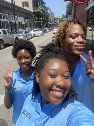 Three HBCUI interns smiling for a photo