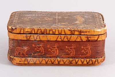 lt= Birch box etched with figures of human figures and animals.