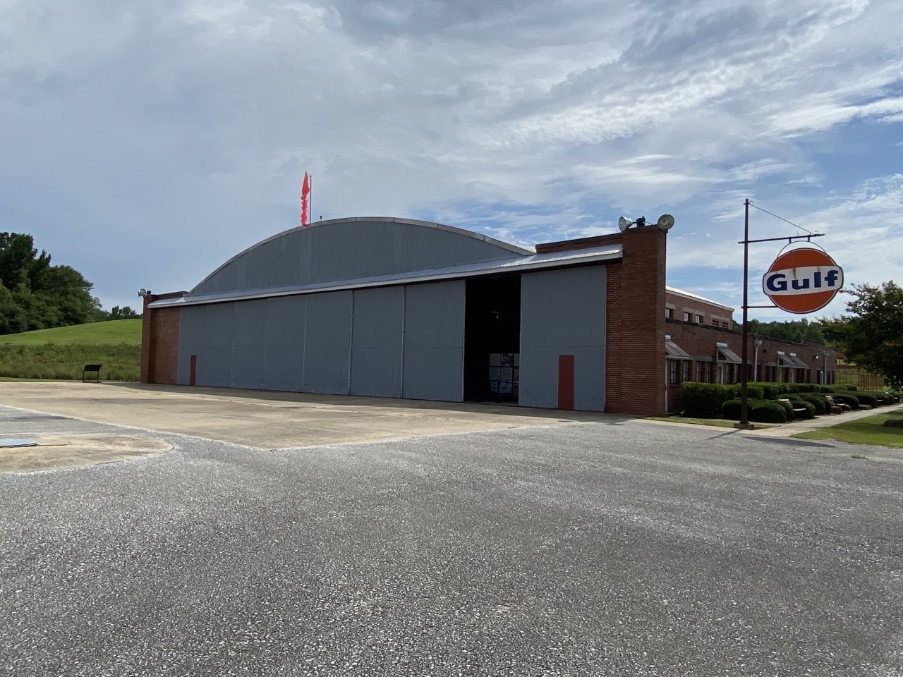 Hangar No.1 museum at the National Historic Site. Moton Airfield (including two Hangars) is part of Tuskegee Airmen National Historic Site. It is located near Tuskegee University (formerly, Institute, and also a National Historic Site). Shown here is an angled view of Hangar No. 1 museum.