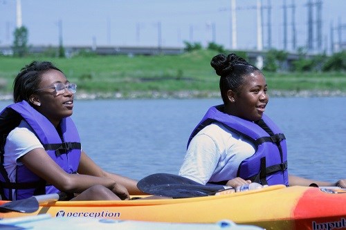 two girls on kayaks