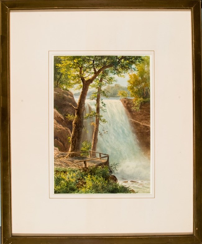 Watercolor painting of waterfall with two trees and green foliage in foreground.