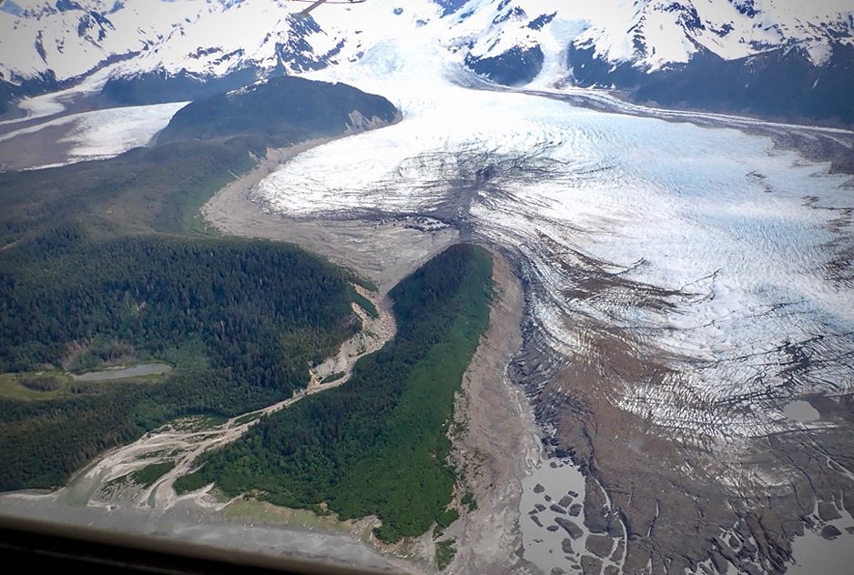 La Perouse glacier An aerial view of a glacier with adjacent forests.
