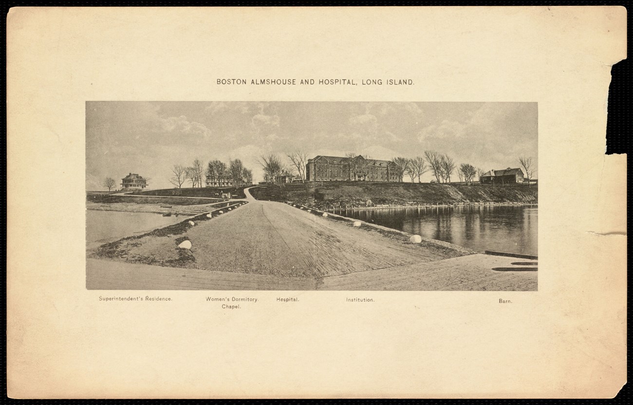 LongIslandHospital-BPL wide shot of island from the pier, with some buildings in the distance.