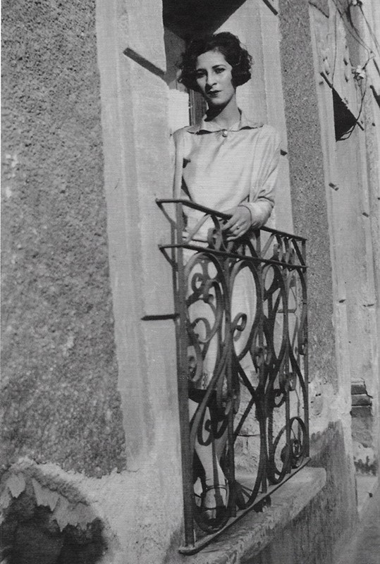Luisa Moreno Luisa Moreno leans against a wrought iron railing on the balcony of a stucco building