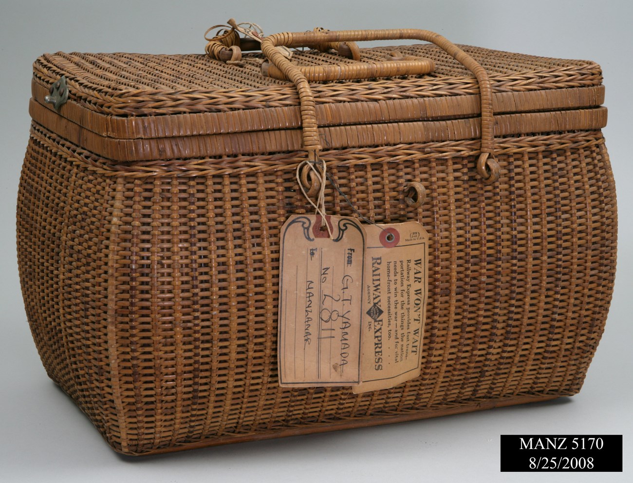 Wicker basket with handles and tags