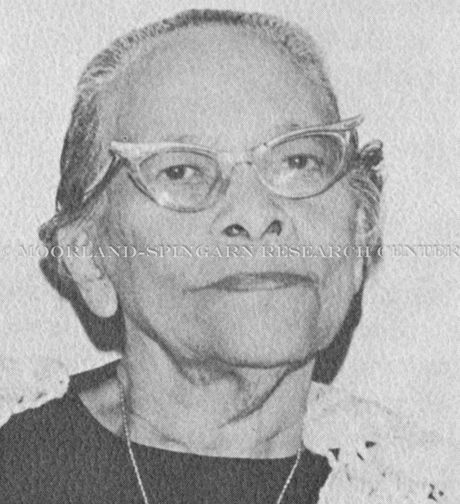Black and white photo of older Black woman with cat eye glasses