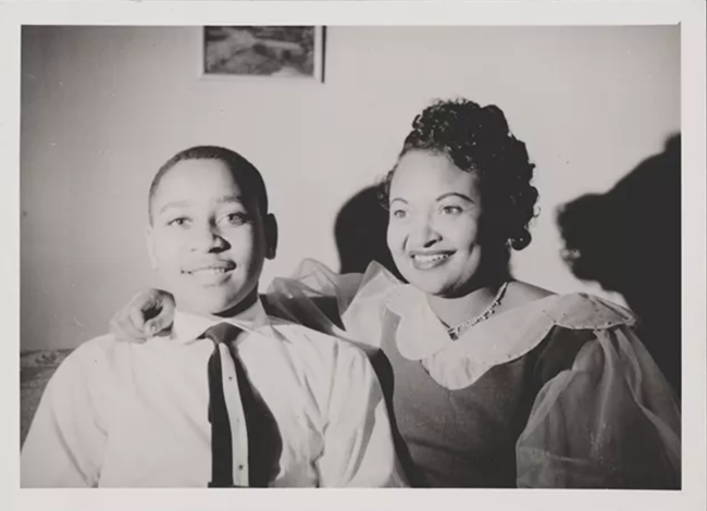Emmett Till and Mamie Till-Mobley A black and white image of a young boy and his mother smiling for the camera