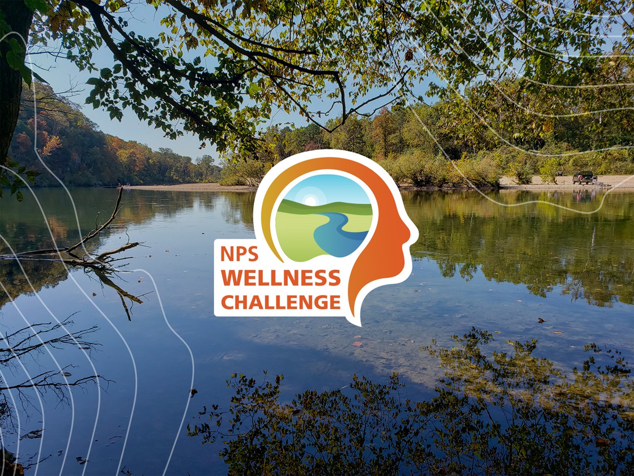 An orange graphic of a head in profile containing an image of a river winding through a landscape that says NPS Wellness Challenge in front of an image of a river scene of clear flowing water during the fall months with fall colors.