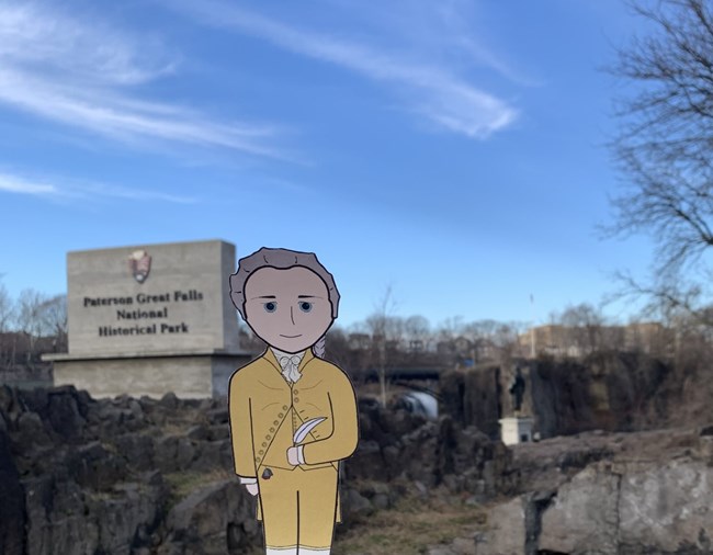 A cutout of a Hamilton illustration against a bluff and river.