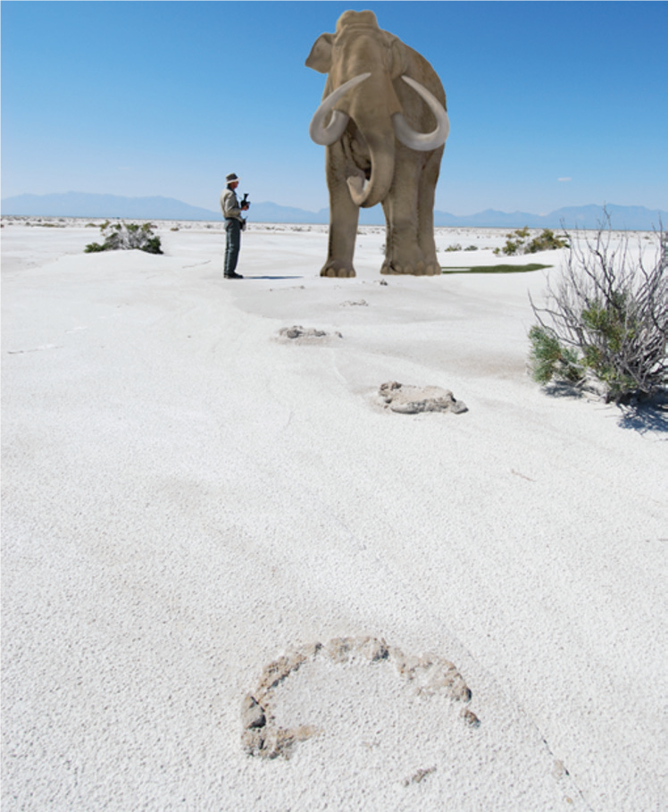 photo illustration of a person standing next to a mammoth on white gypsum sand dunes