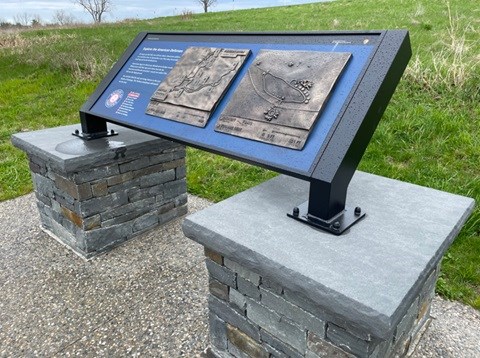 Two bronze relief maps constructed on wayside with two pillars below the legs showing location along the tour.