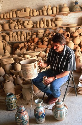 The European art of glazed mayólica (majolica pottery) is among the various artistic traditions that took root in the Americas following the Spanish conquest. Modern-day artisans such as Capello, shown here at his pottery studio in Guanajuato, Mexico, con