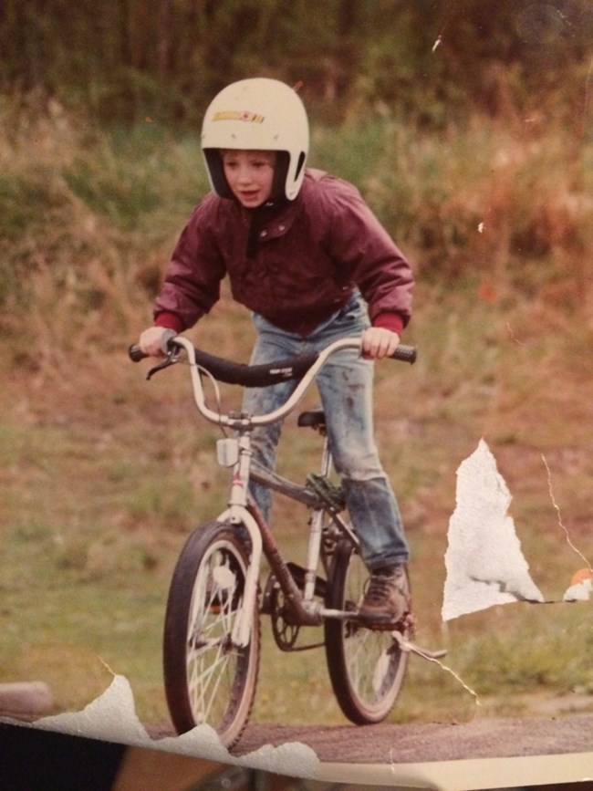 Boy riding his bike.