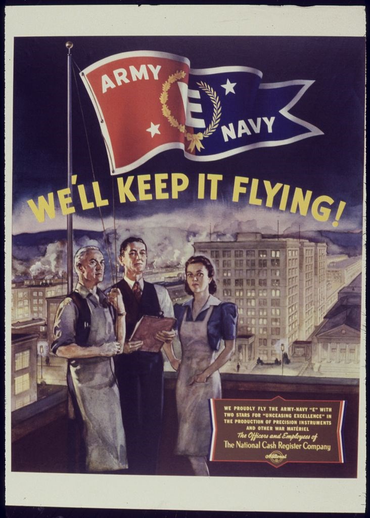 Illustration of 3 factory workers (a gray-haired man, middle-aged man, and younger woman) posing on a rooftop below an Army/Navy E for excellence flag. "We'll keep it flying!" appears in yellow text above them.