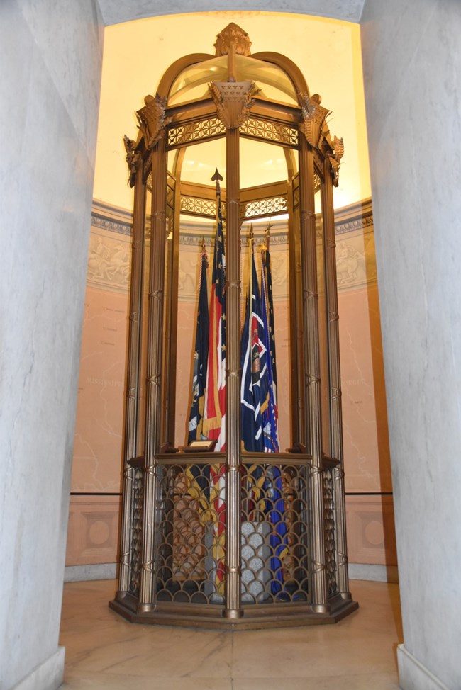 West Trophy Room at General Grant National Memorial Bronze case with glass windows displaying various flags