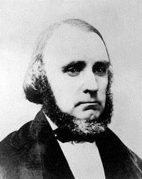 William Clayton A black and white image of a man with a chinstrap beard.