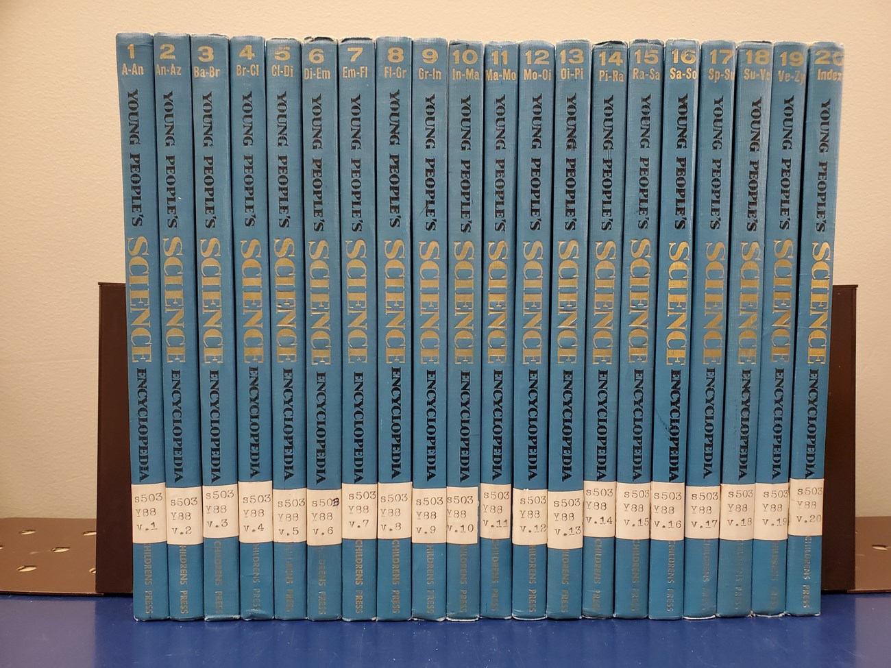 An encyclopedia set from the 1960s. The books are blue, and the spine reads Young People's Science Encyclopedia.