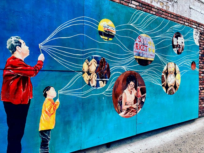 Mural of man and child blowing bubbles