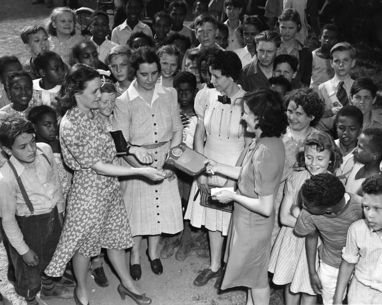 A Clark school representative receives a plaque after winning a five school meet, circa 1941