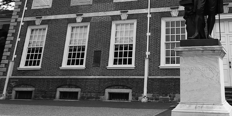 Independence Hall Black and white photo showing four closed windows.