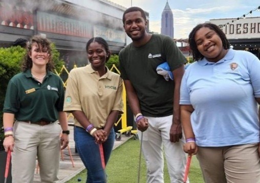 Greening Youth Foundation interns posing for a group picture before playing miniature golf