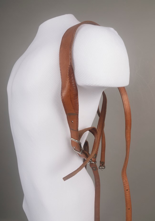HFCA 1921 on a mannequin Leather backpack straps fitted to a mannequin torso