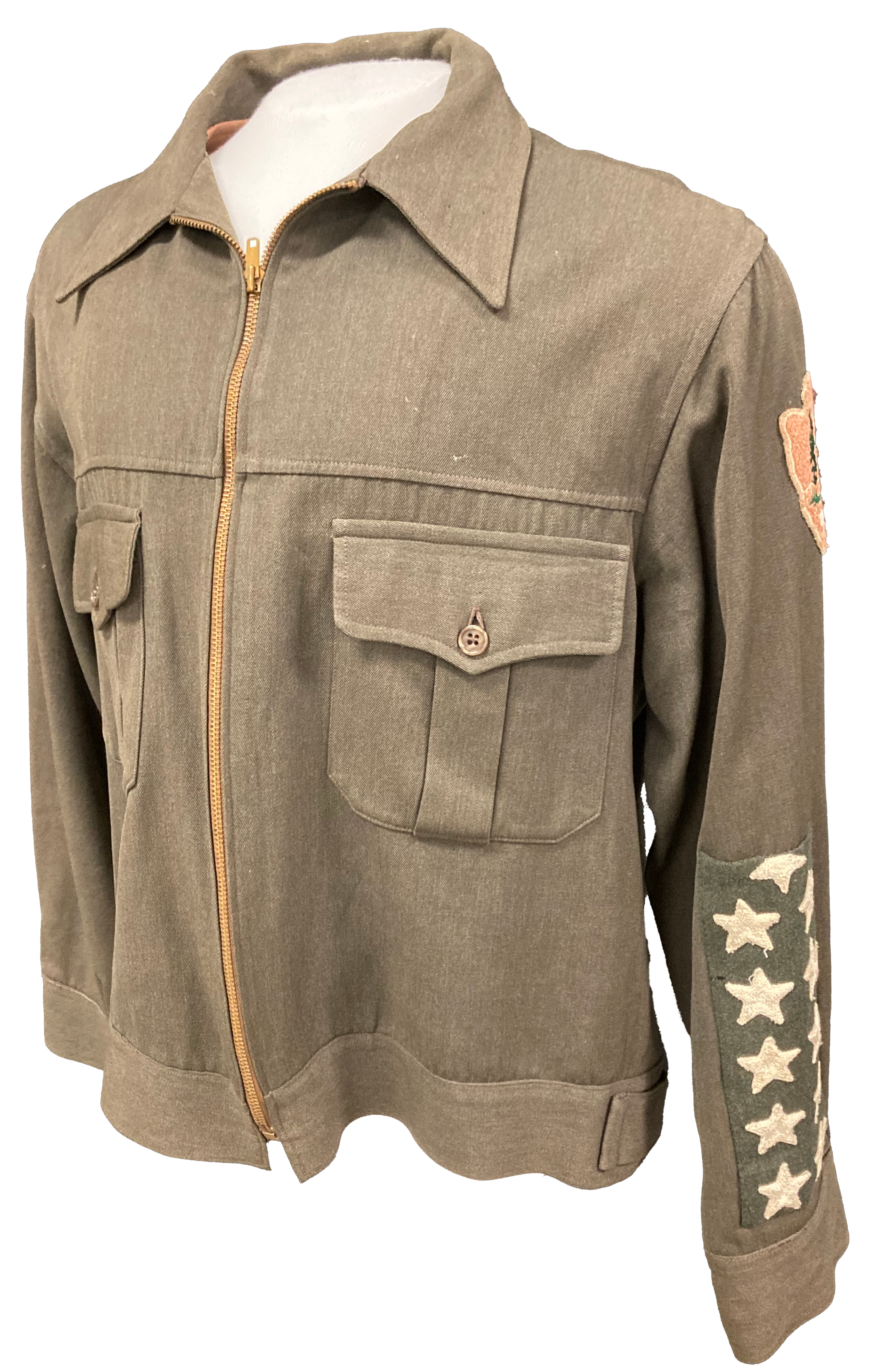Green jacket with oversized stars on sleeve and arrowhead patch