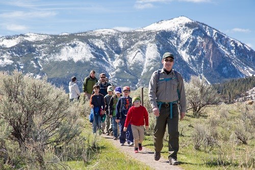 park ranger taking kids for a hike on mountain