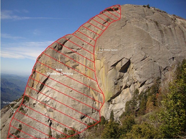 lt= Digitally drawn red lines block off a section of a round granite cliff