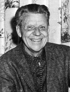 Black and white photo of a smiling Olaus Murie