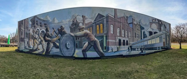 Outdoor mural on curved wall