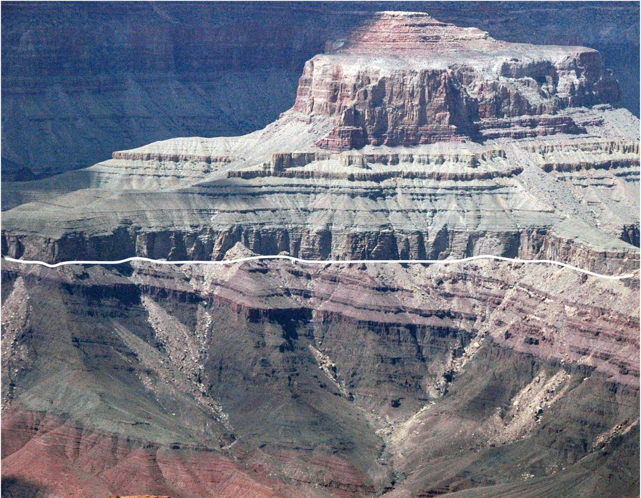 thumbnail_Great Angular Unconformity Photo of banded rocky cliffs.